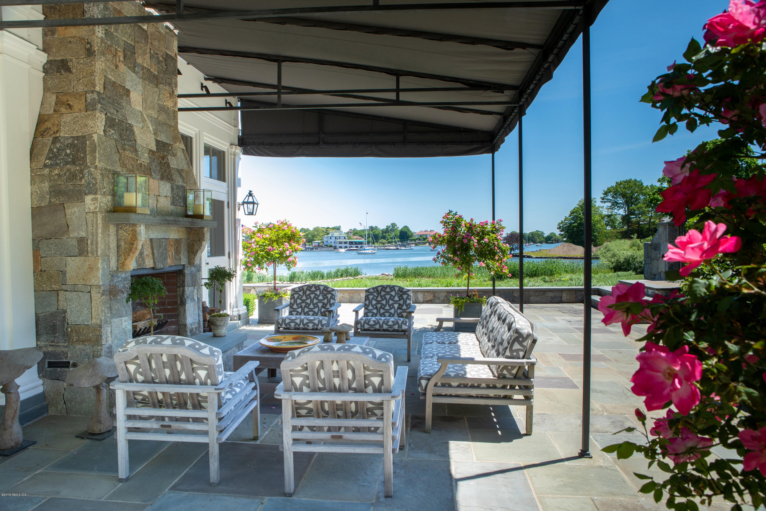 23 Smith Road Greenwich, CT 06830 - Photo 17 of 52 a outdoor living space with furniture and garden view