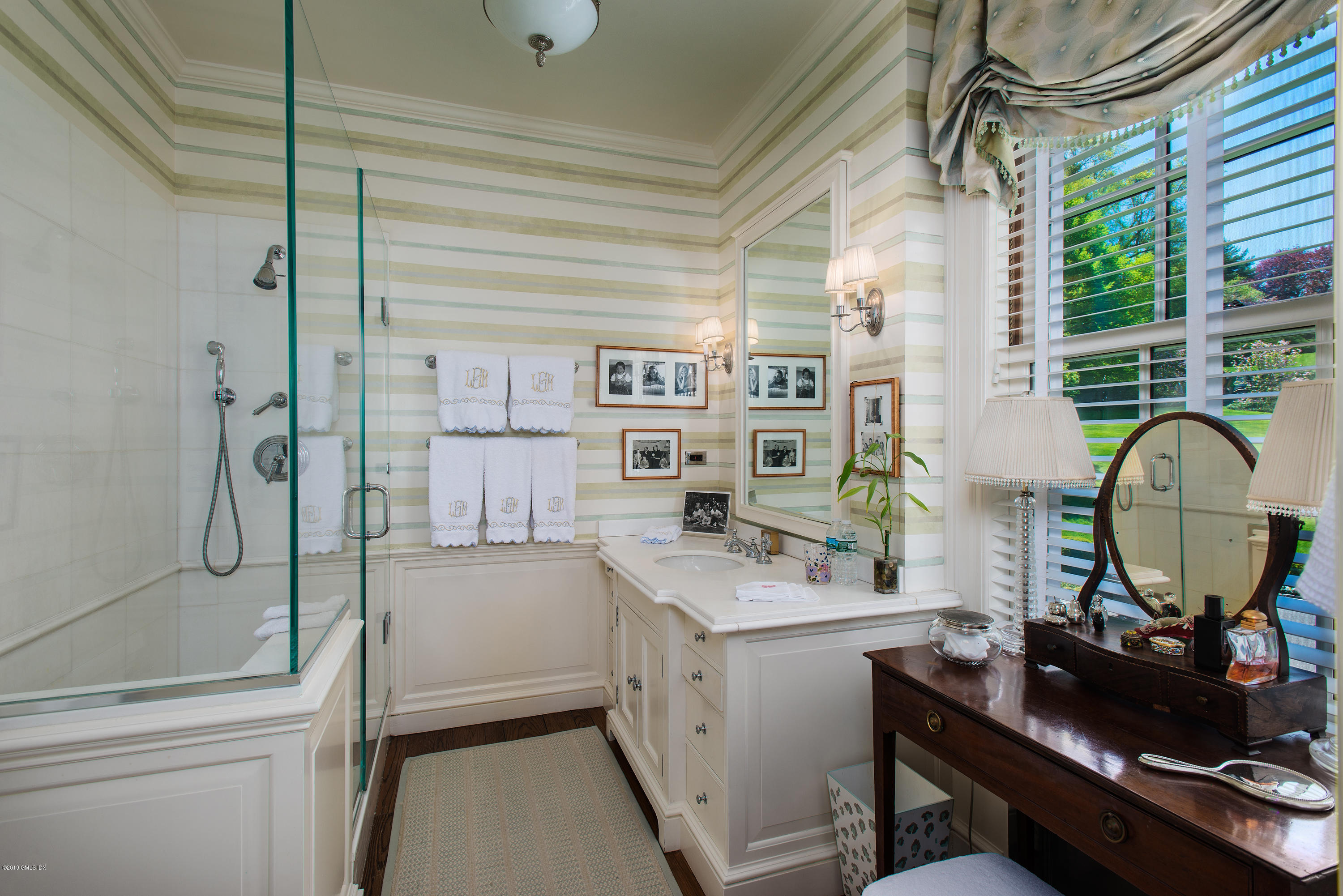 23 Smith Road Greenwich, CT 06830 - Photo 19 of 52 a bathroom with a sink a toilet and shower