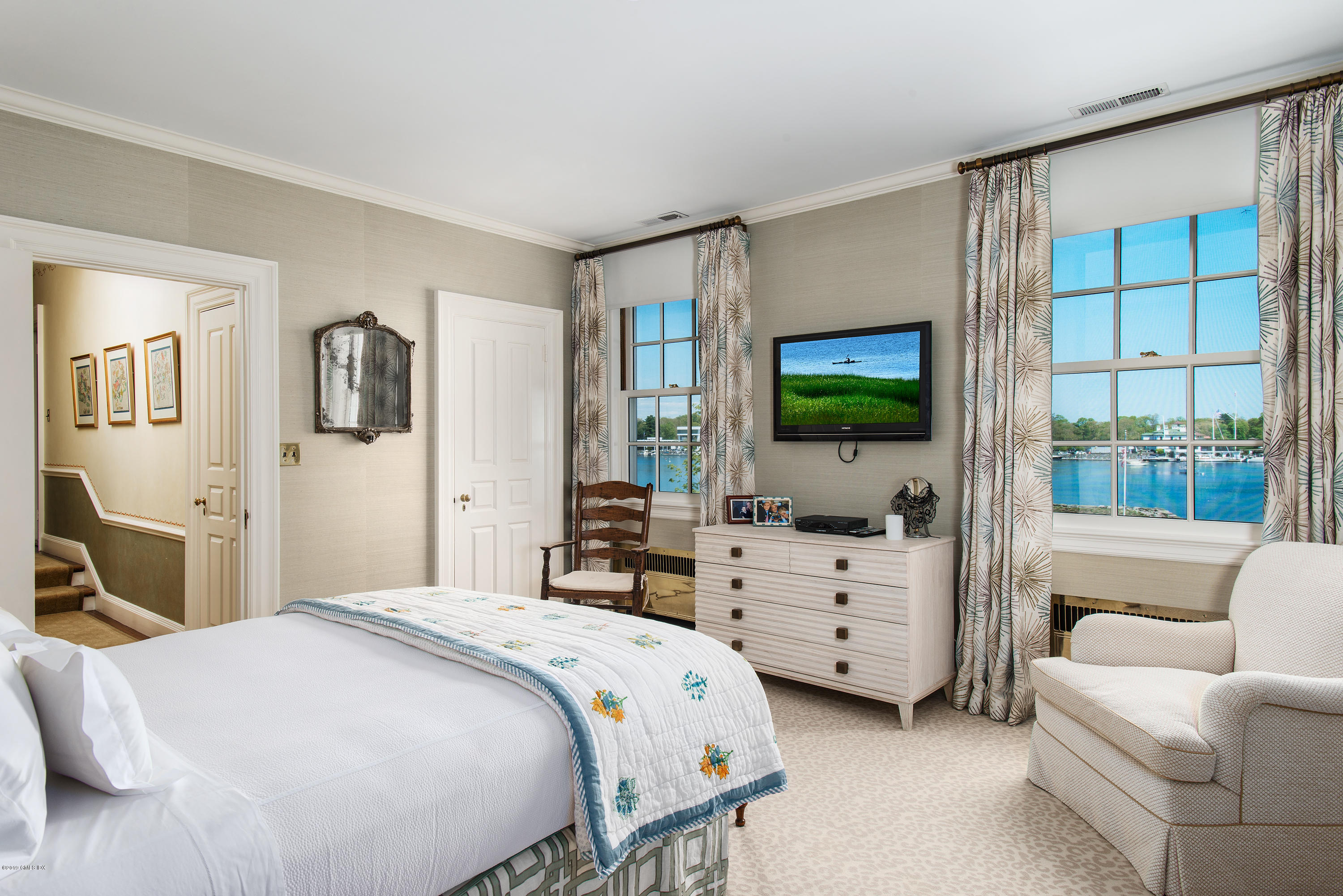 23 Smith Road Greenwich, CT 06830 - Photo 20 of 52 a bedroom with a bed and a flat screen tv