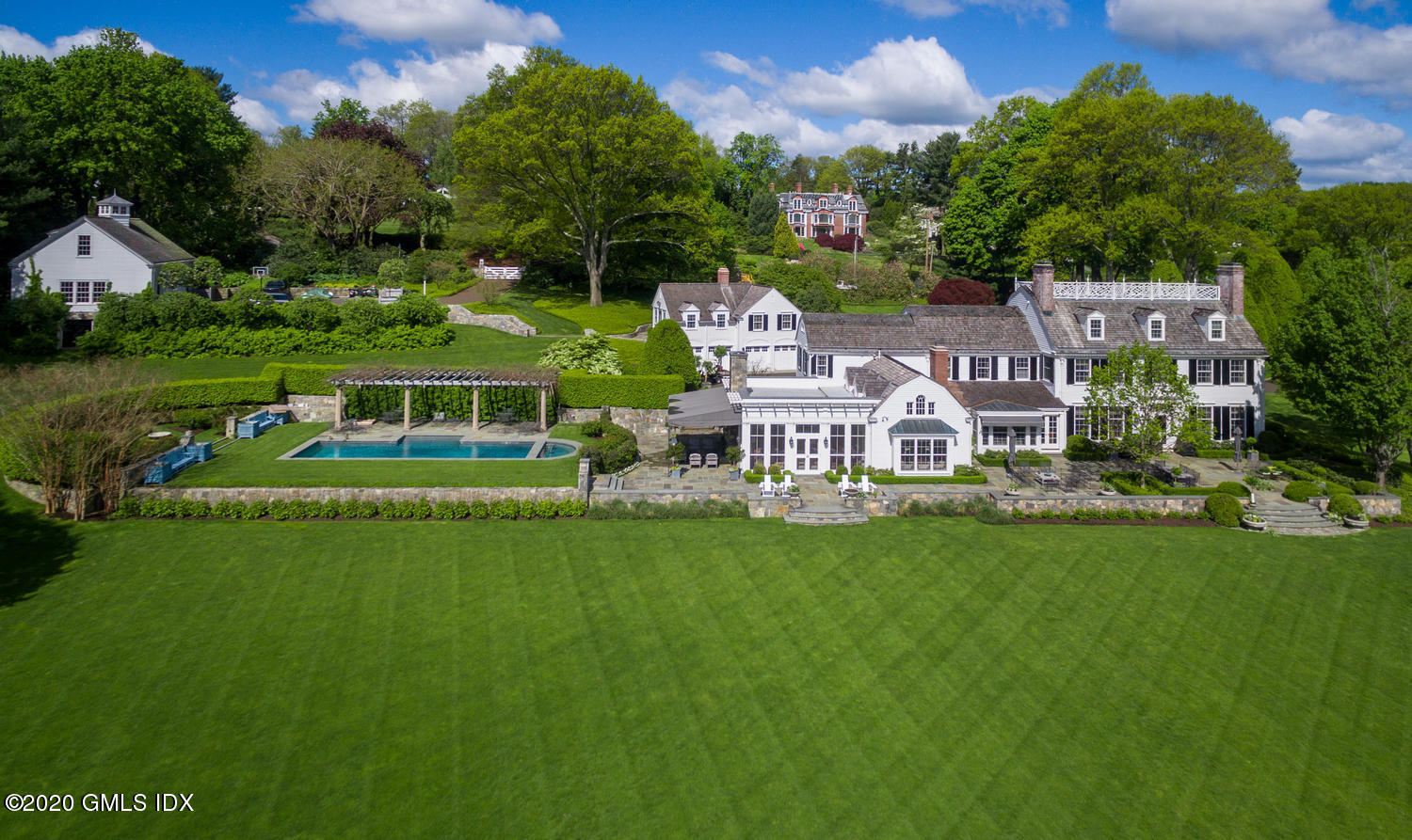 23 Smith Road Greenwich, CT 06830 - Photo 2 of 52 a view of house with a garden