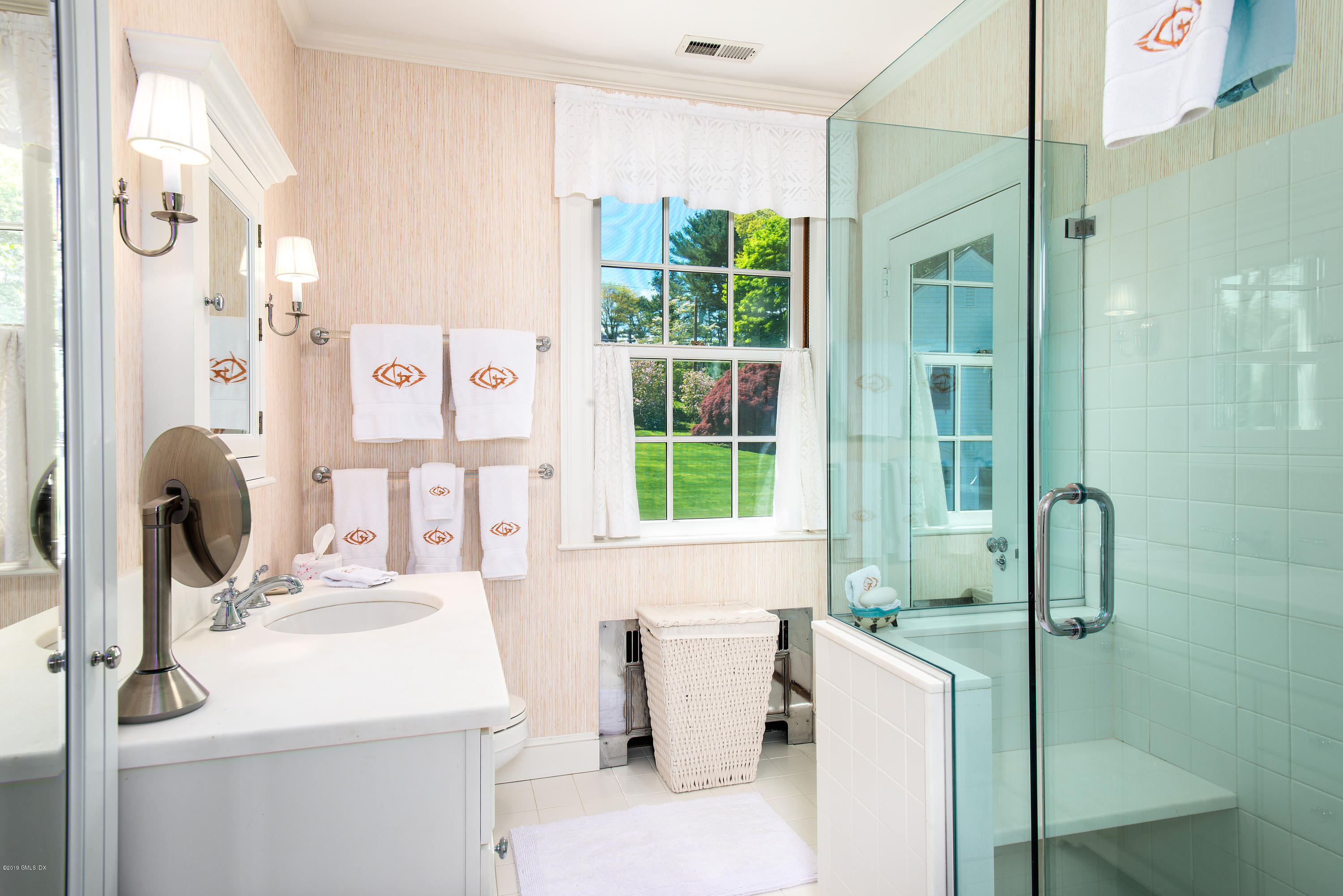 23 Smith Road Greenwich, CT 06830 - Photo 22 of 52 a bathroom with a sink and a mirror