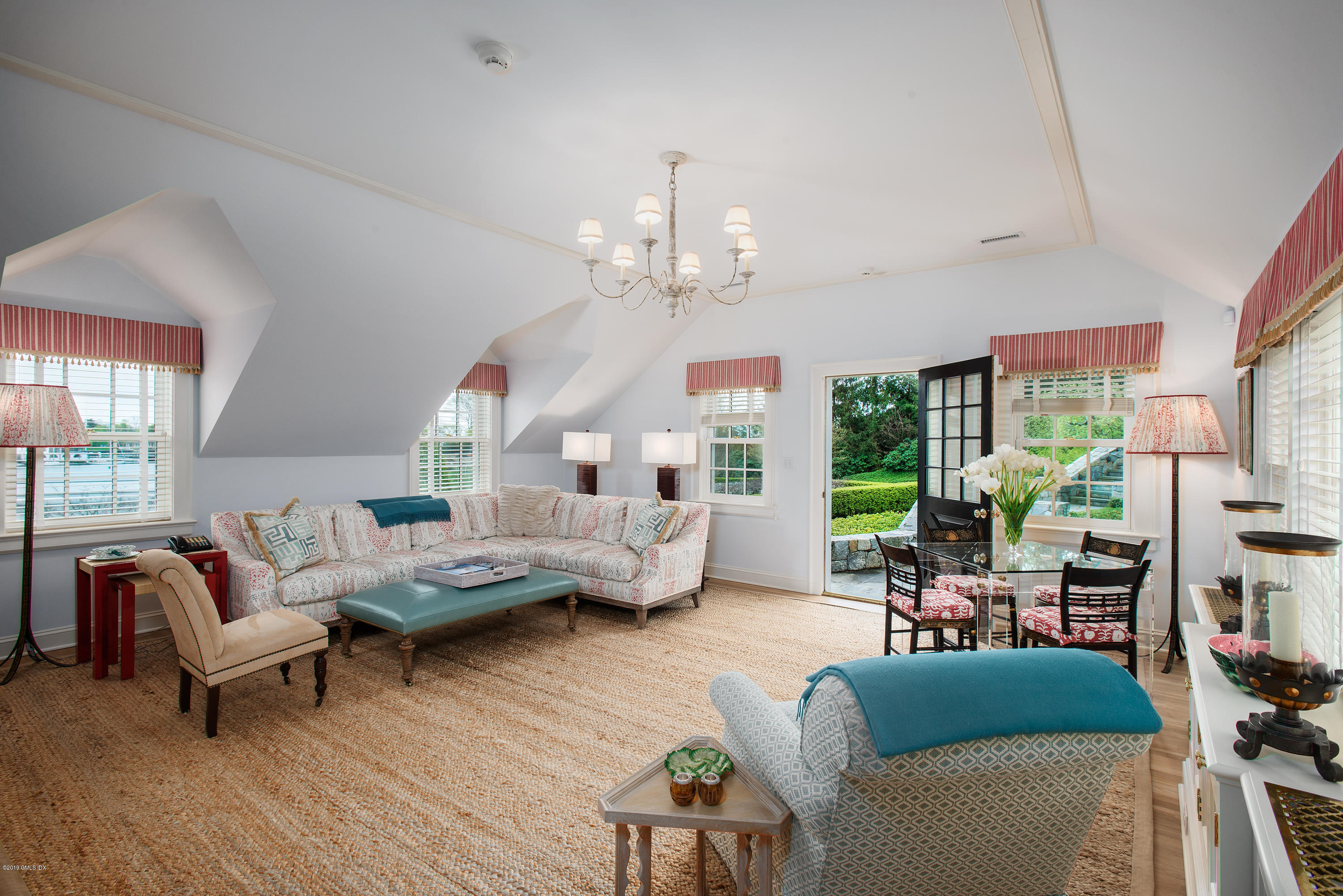 23 Smith Road Greenwich, CT 06830 - Photo 26 of 52 a living room with furniture chandelier and a large window
