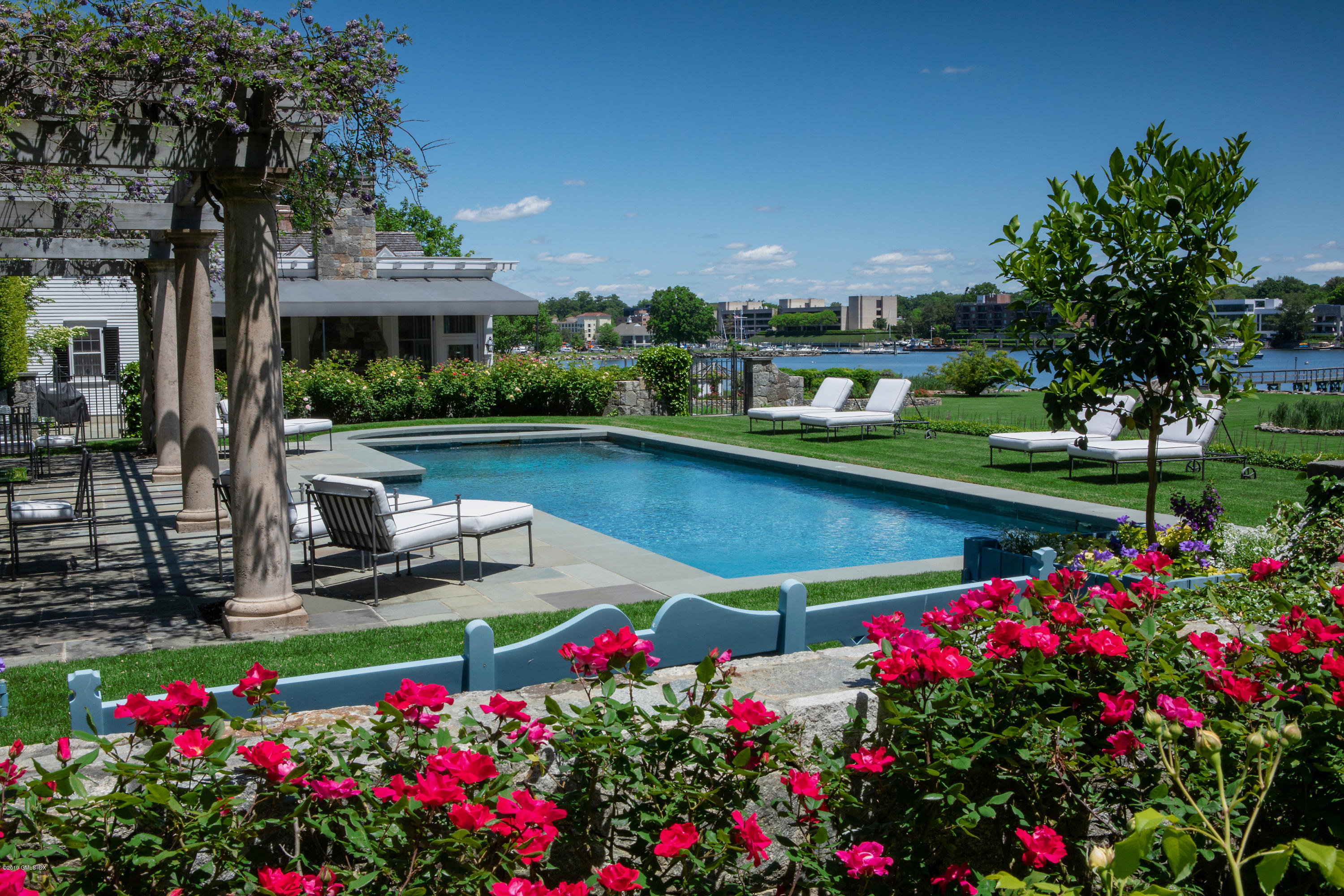 23 Smith Road Greenwich, CT 06830 - Photo 29 of 52 a view of a swimming pool with a garden