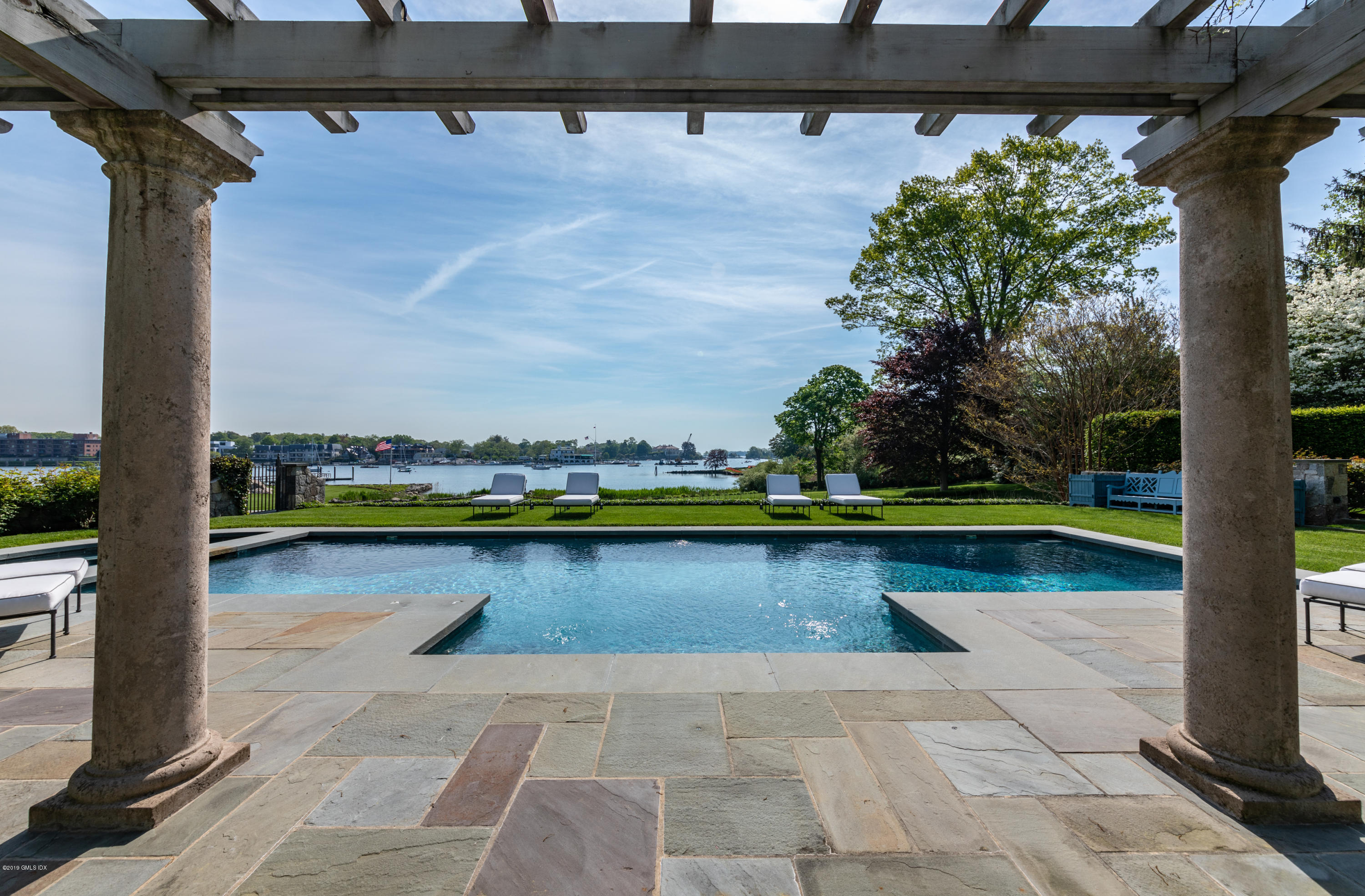 23 Smith Road Greenwich, CT 06830 - Photo 34 of 52 a view of swimming pool with outdoor seating and yard