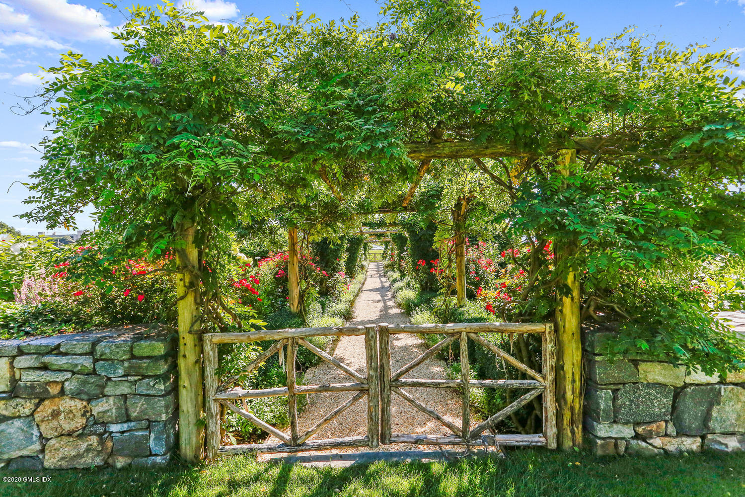 23 Smith Road Greenwich, CT 06830 - Photo 36 of 52 a backyard of a house with lots of green space