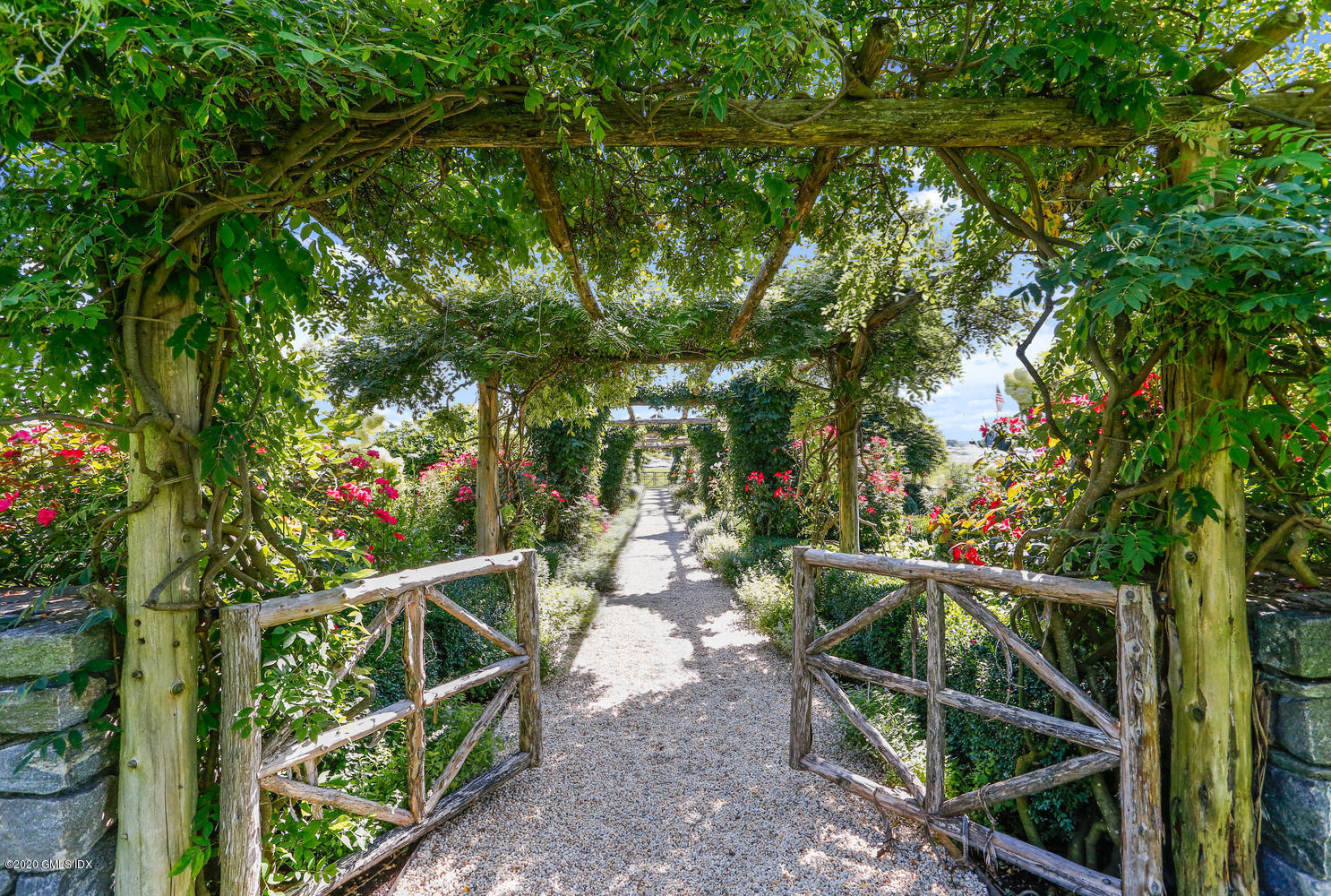 23 Smith Road Greenwich, CT 06830 - Photo 37 of 52 a backyard of a house with lots of green space