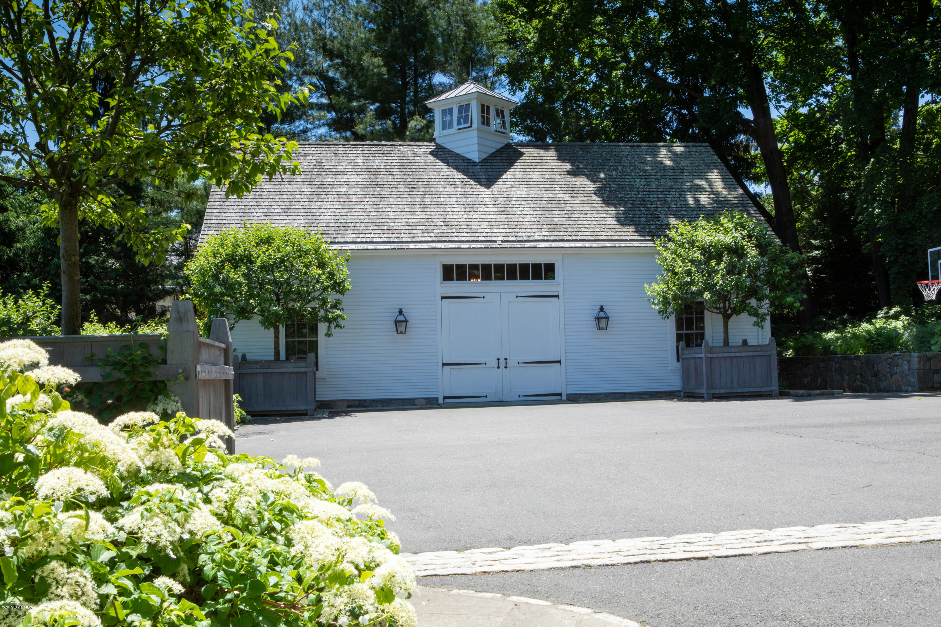 23 Smith Road Greenwich, CT 06830 - Photo 45 of 52 a front view of a house with a yard