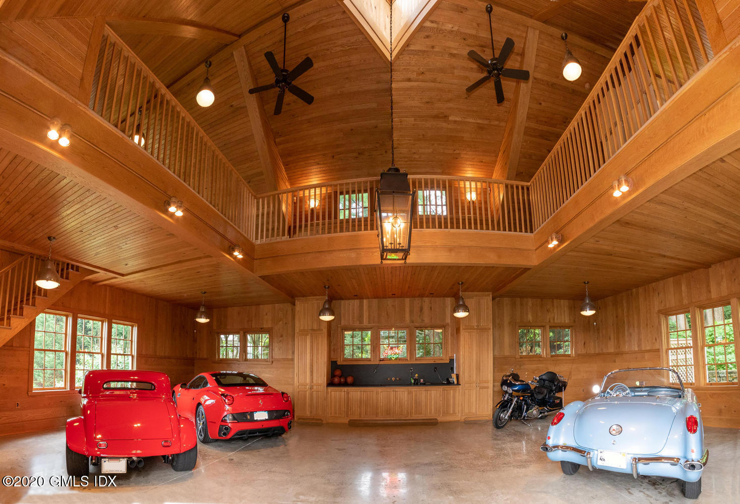 23 Smith Road Greenwich, CT 06830 - Photo 46 of 52 a room with lots of car parked