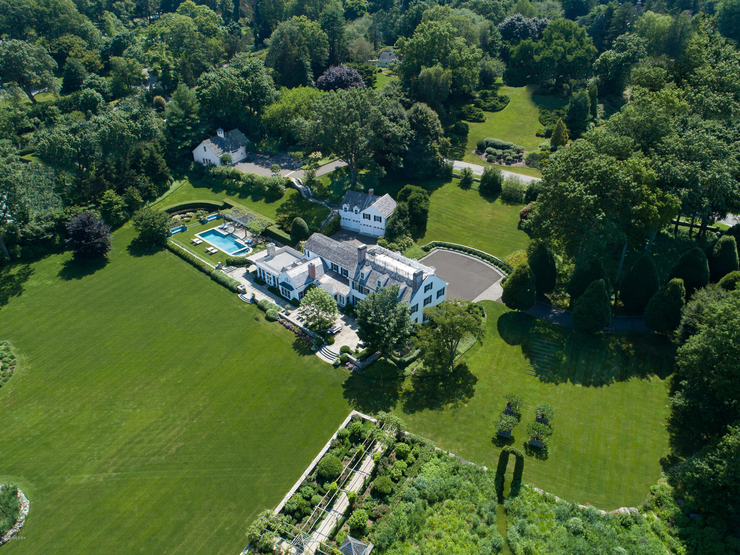 23 Smith Road Greenwich, CT 06830 - Photo 48 of 52 an aerial view of a golf course with parking space