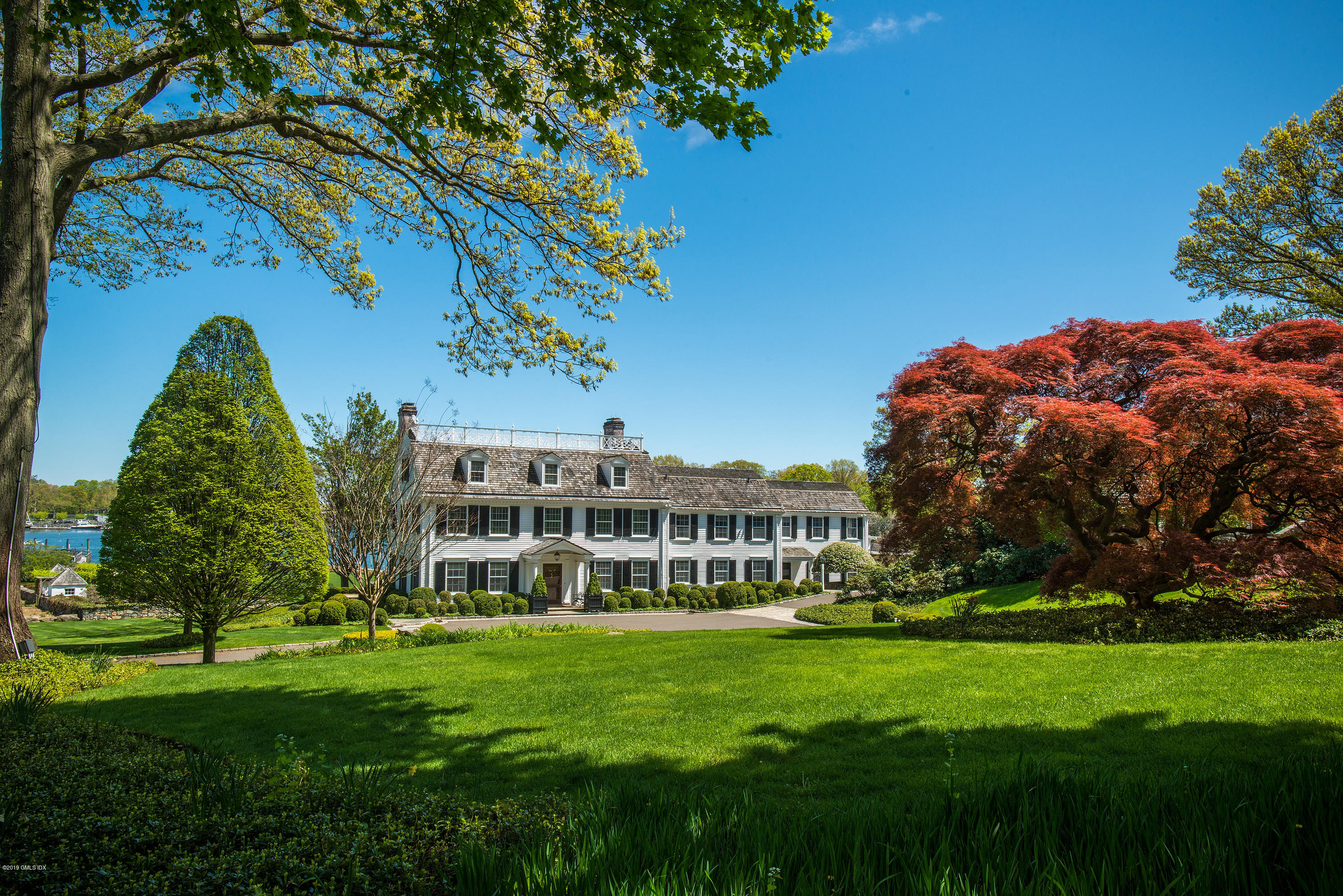 23 Smith Road Greenwich, CT 06830 - Photo 5 of 52 a view of a house with a big yard