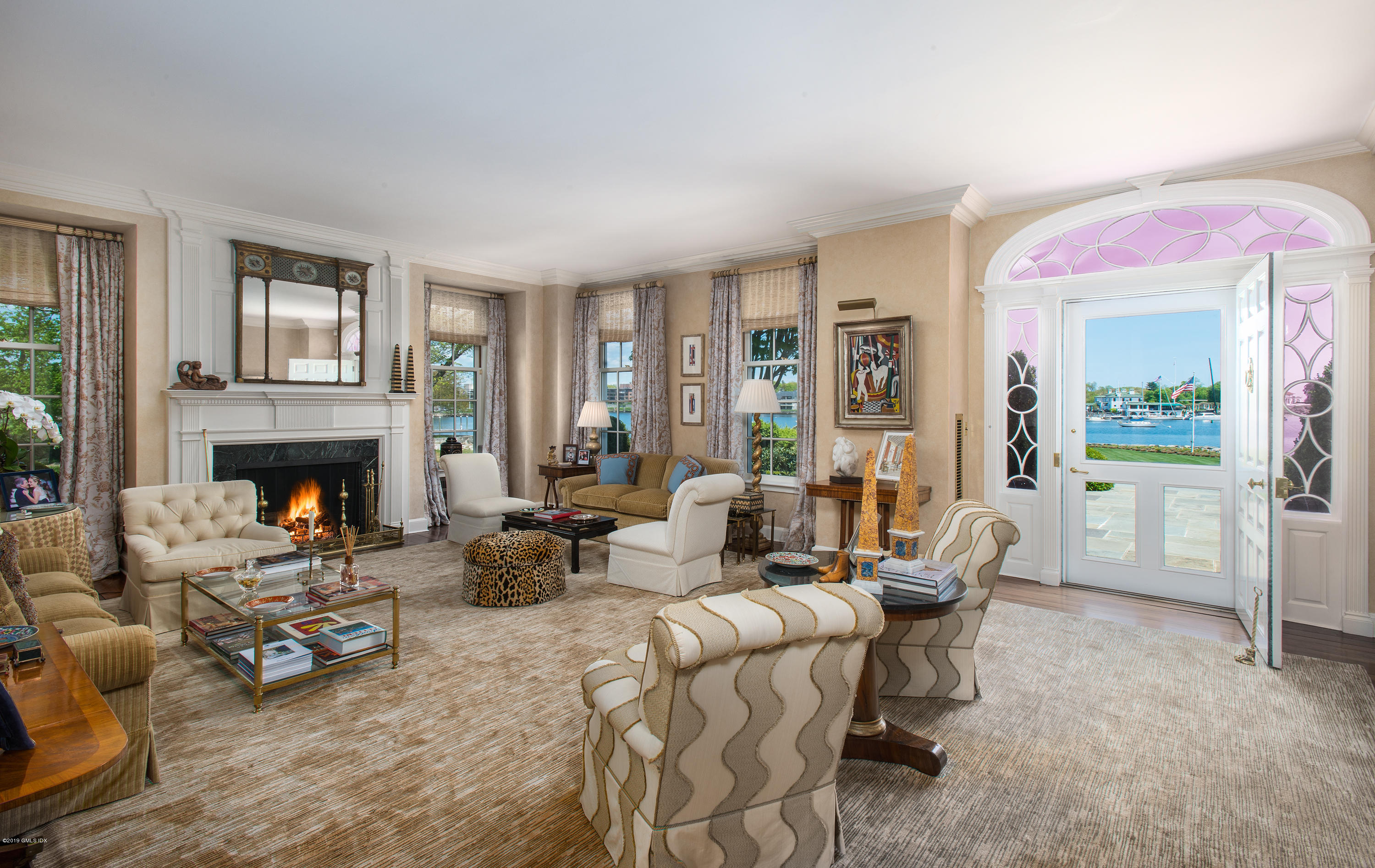 23 Smith Road Greenwich, CT 06830 - Photo 9 of 52 a living room with furniture and a fireplace