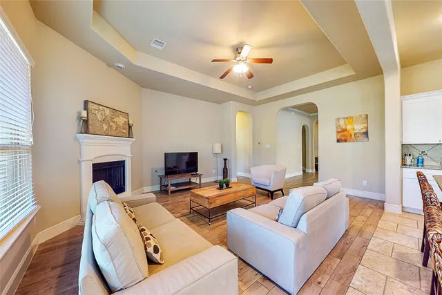 a living room with furniture and a fireplace
