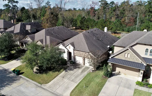 a aerial view of a house with a yard