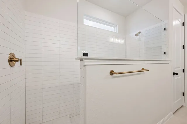 a view of a hallway with wooden floor and entryway