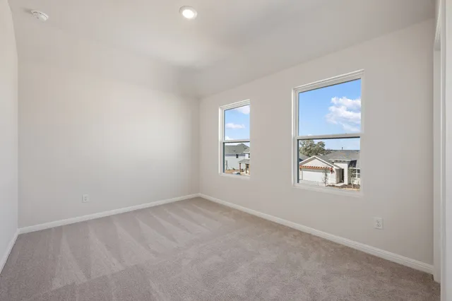 a view of a house with a flat front yard