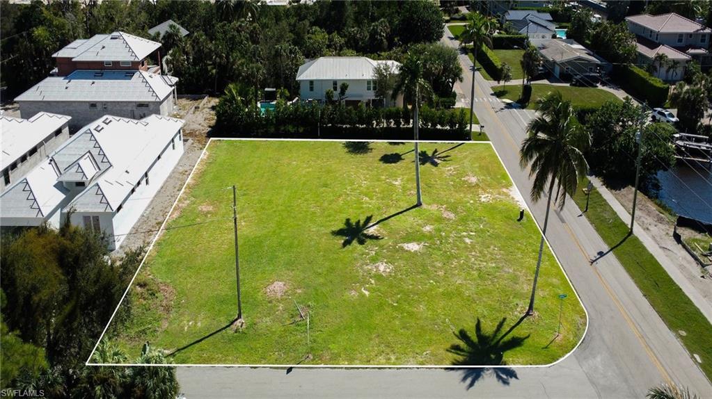 1427 Sandpiper Street Naples, FL 34102 - Photo 6 of 6 an aerial view of a swimming pool