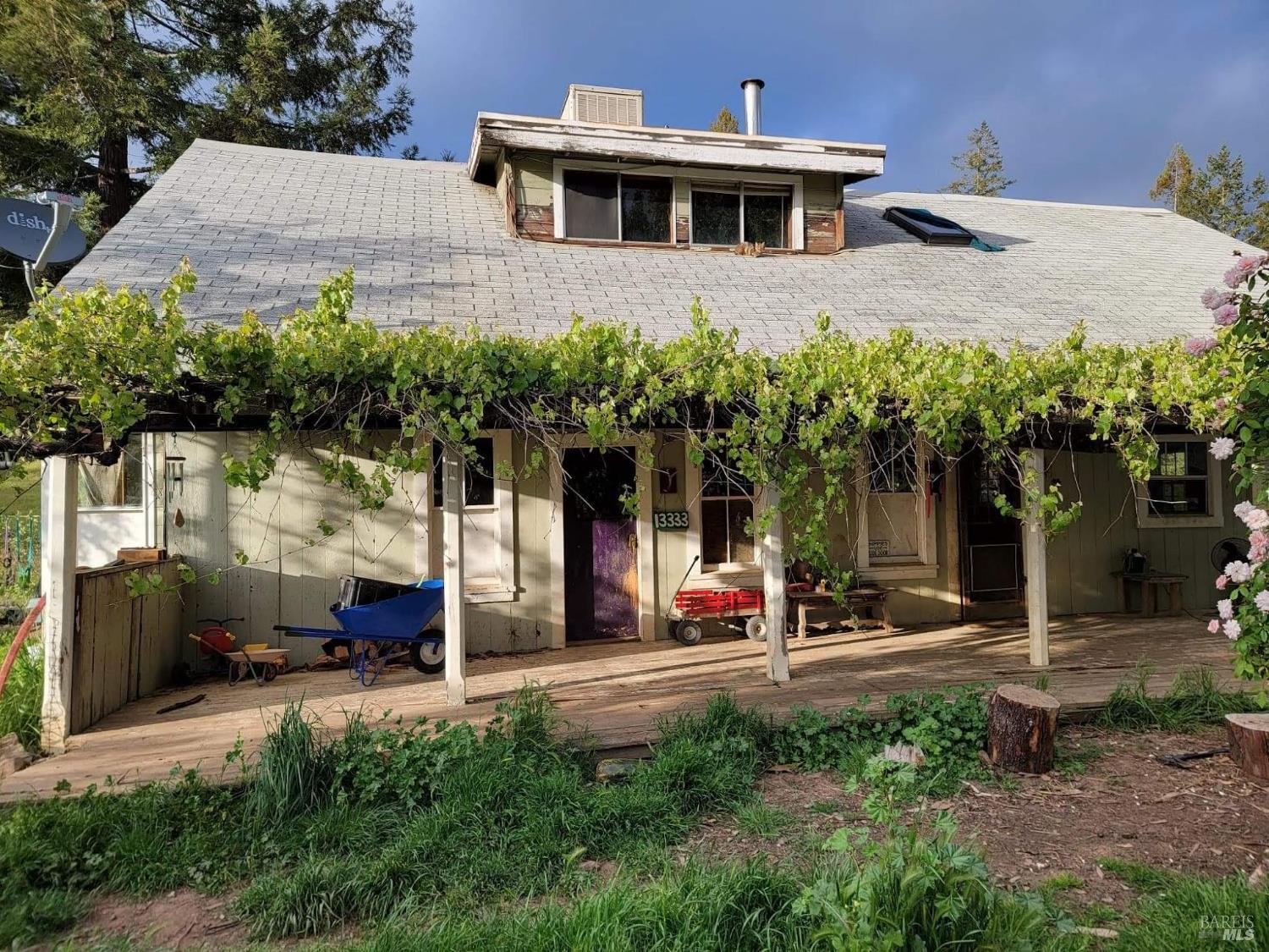 13333 Low Gap Road Ukiah, CA 95482 - Photo 2 of 50 a view of a building with a yard and plants