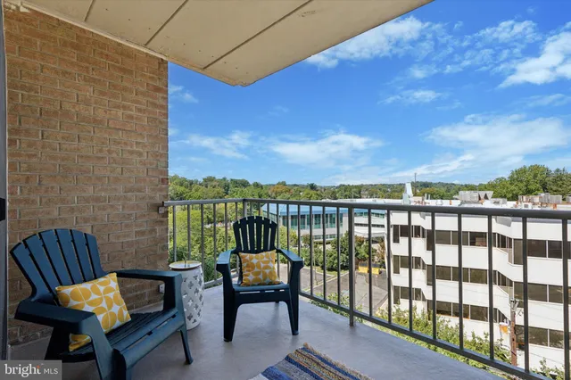 a balcony with chairs