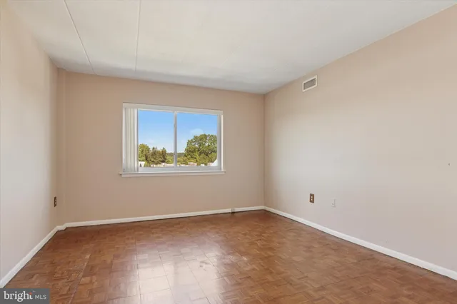 a view of an empty room with a window