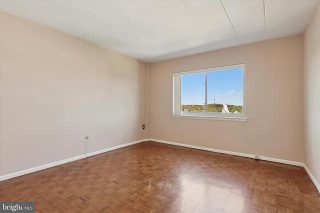 a view of an empty room with a window