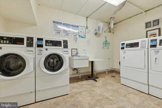 a view of a storage & utility room with washer and dryer