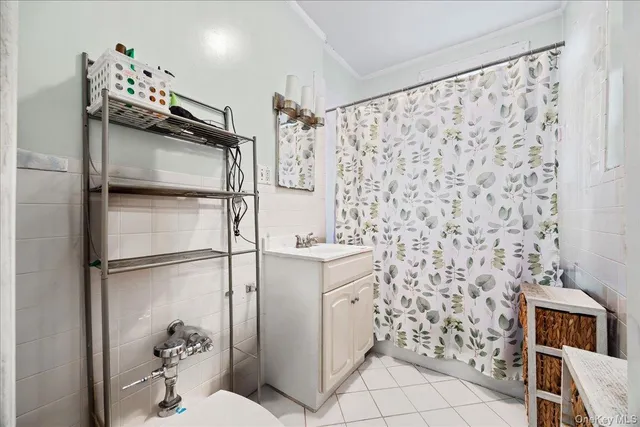 a bathroom with a shower toilet and sink