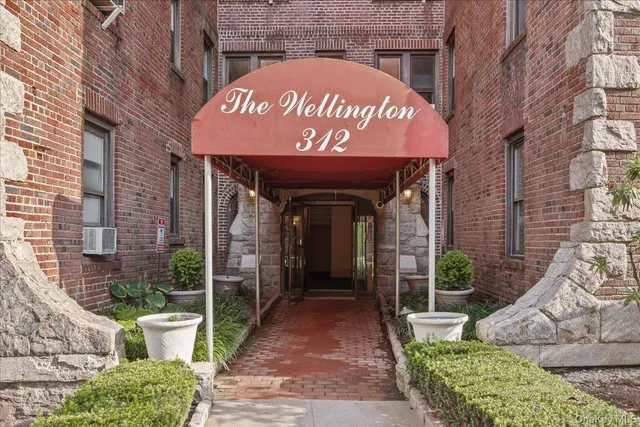 a view of a brick building with a large window
