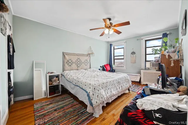 a bedroom with bed and a chandelier