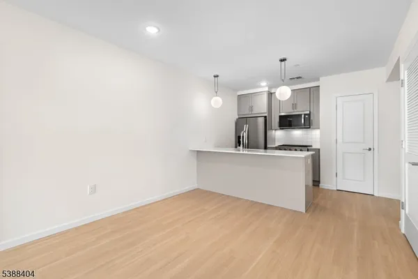 a view of kitchen with wooden floor