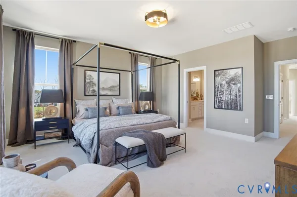 a bedroom with bed and glass door