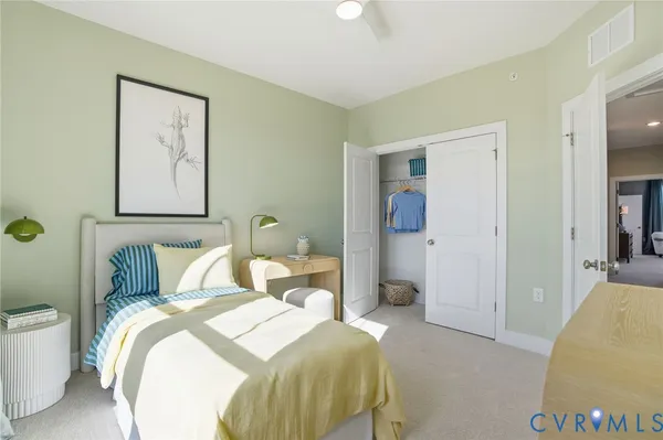 a bedroom with a bed and a couch