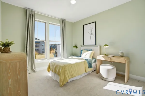 a bedroom with a bed and window