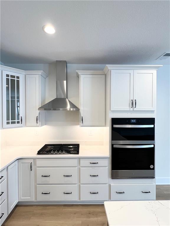 107 Hemingway Lane Coraopolis, PA 15108 - Photo 14 of 32 a kitchen with granite countertop white cabinets and stainless steel appliances
