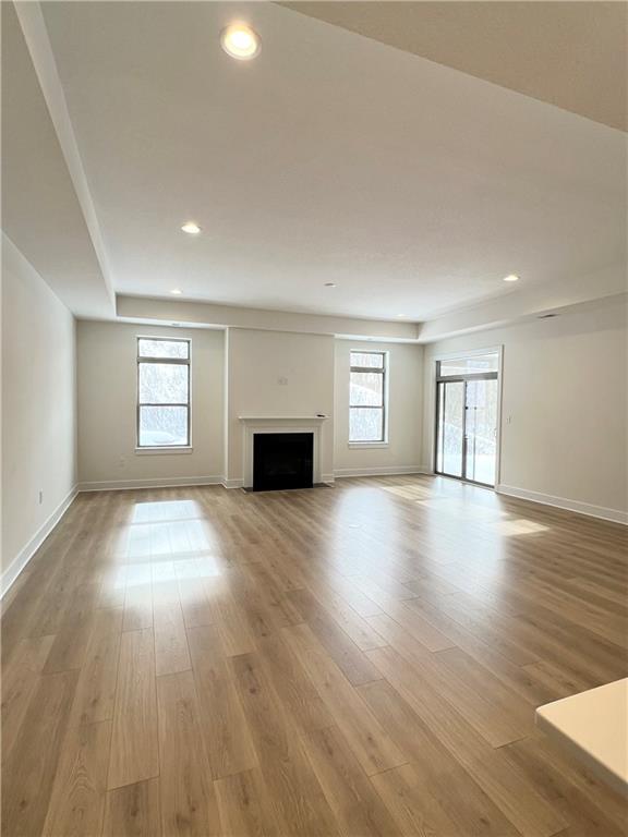 107 Hemingway Lane Coraopolis, PA 15108 - Photo 17 of 32 a view of empty room with a fireplace and wooden floor