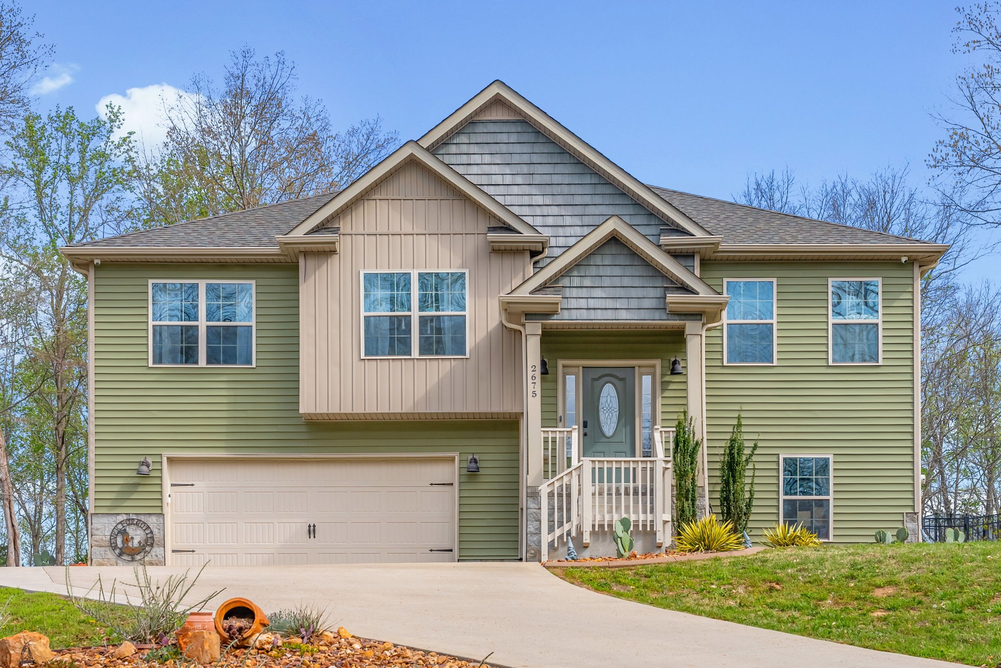 a front view of a house with garden
