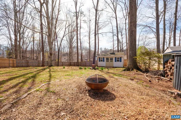 a swimming pool with outdoor seating and yard