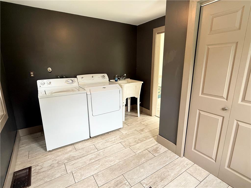 740 Engler Road Nazareth, PA 18064 - Photo 7 of 27 A foyer/laundry room with functional appliances and ample space for household tasks.