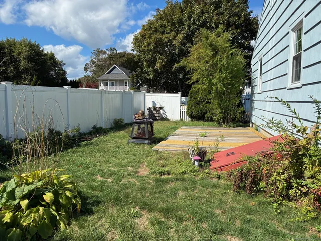 a view of a backyard with swimming pool