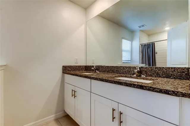 a utility room with cabinets