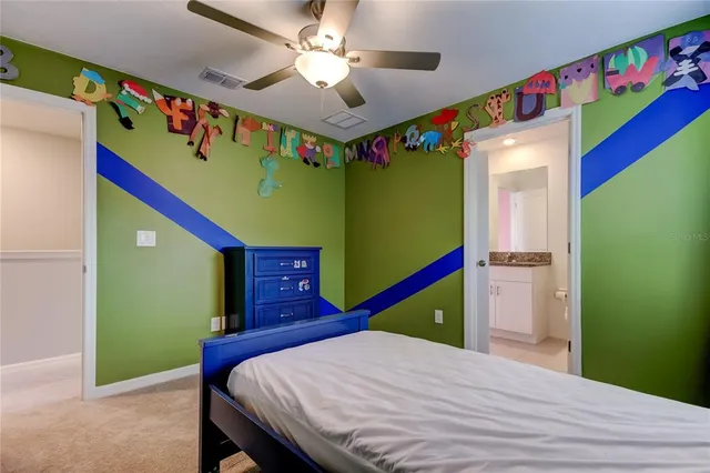 a bedroom with a bed and a dresser