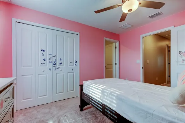 a bed room with a bed and a dresser