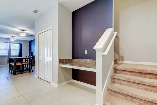 a view of living room with furniture and a fireplace