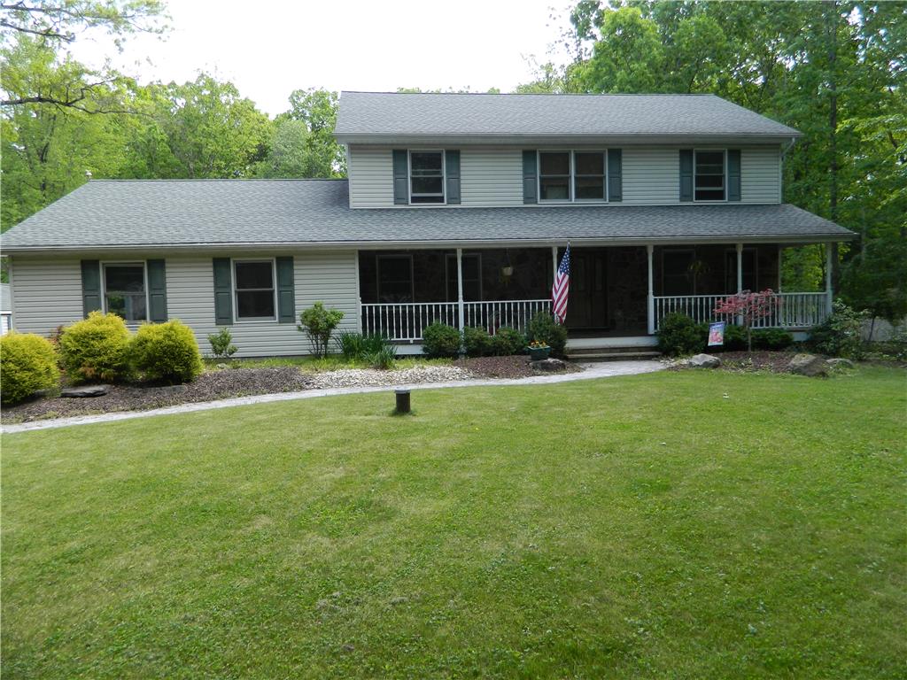 328 Pin Oak Road Stroudsburg, PA 18360 - Photo 1 of 37 A classic two-story home features a full-length covered porch and inviting landscaping.