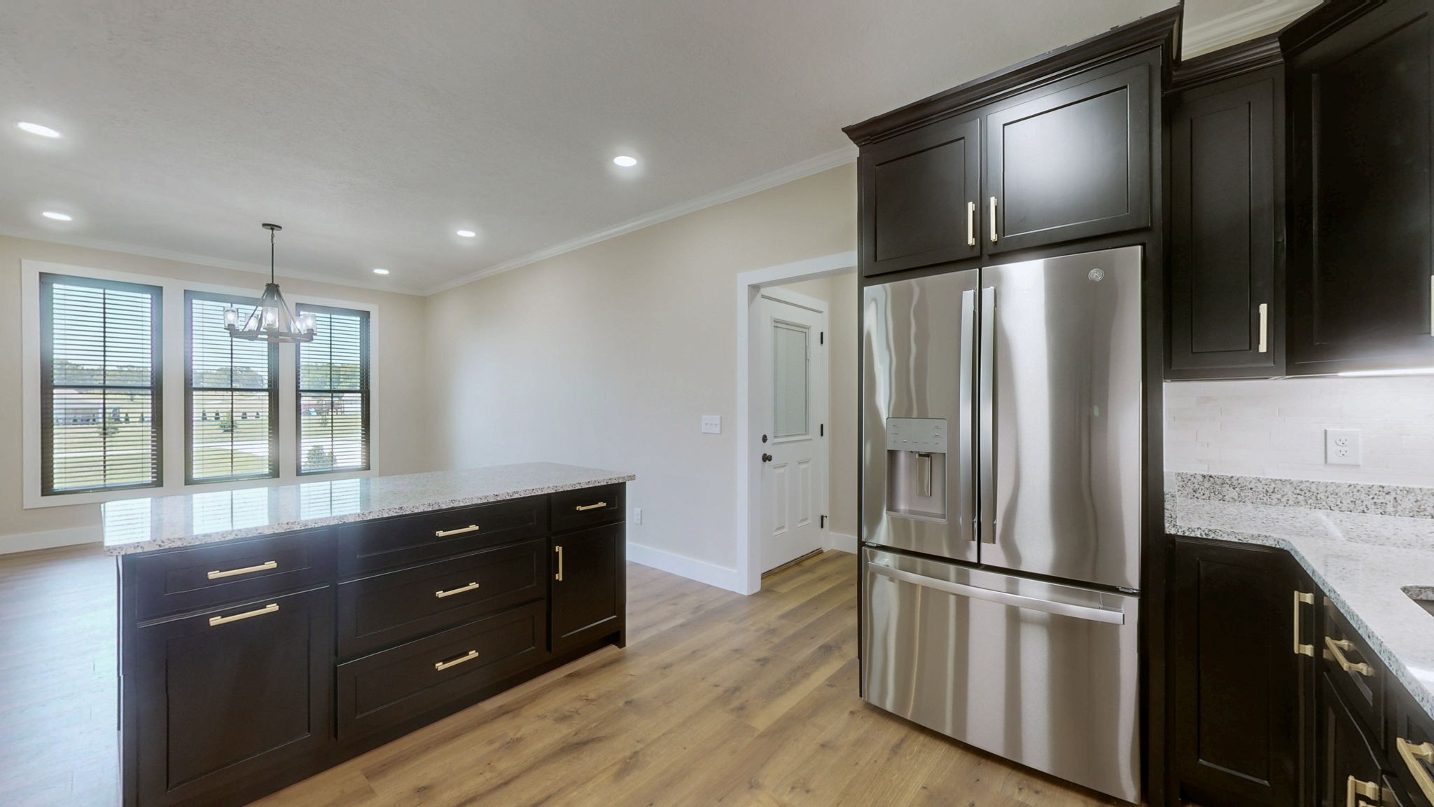865 Alman Cemetery Road Paris, TN 38242 - Photo 11 of 41 a kitchen with a refrigerator and a dresser