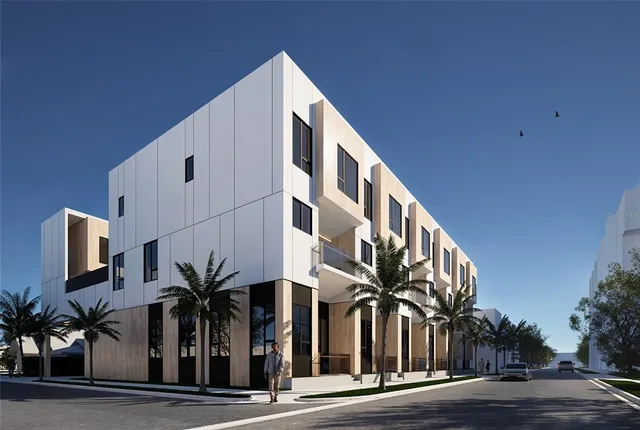 a view of a house with windows and flower plants