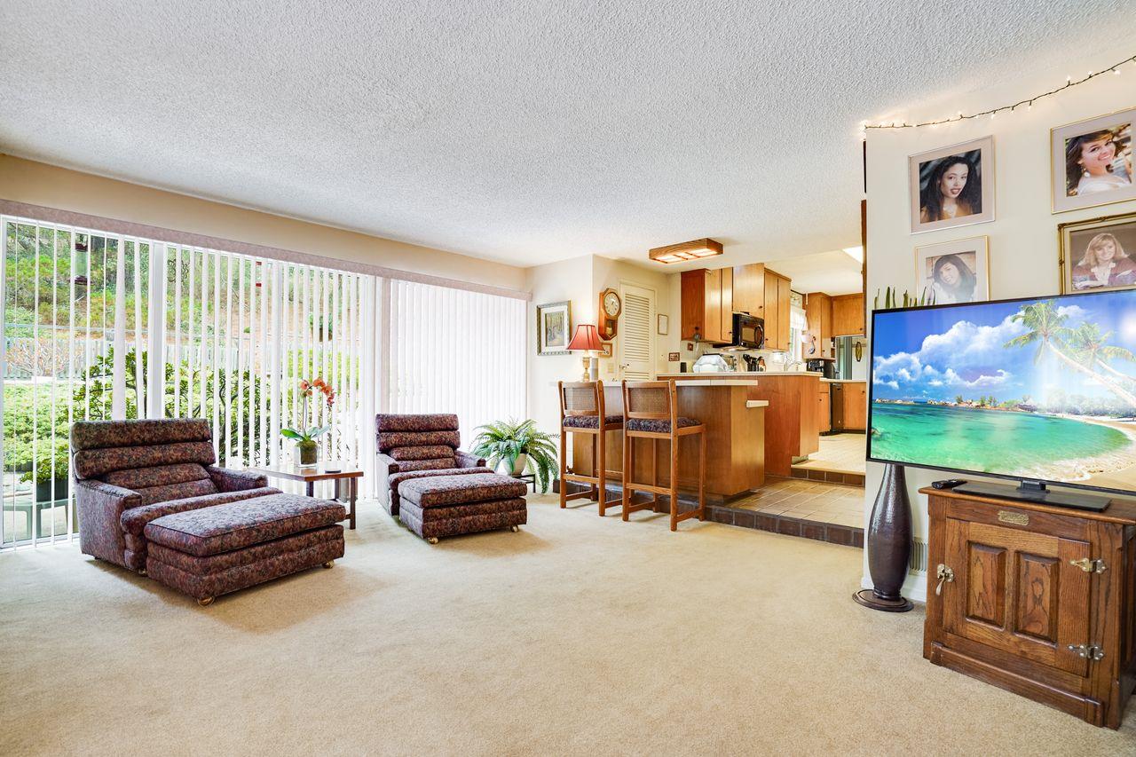 3 Forest Knoll Road Monterey, CA 93940 - Photo 32 of 63 a living room with furniture and a flat screen tv