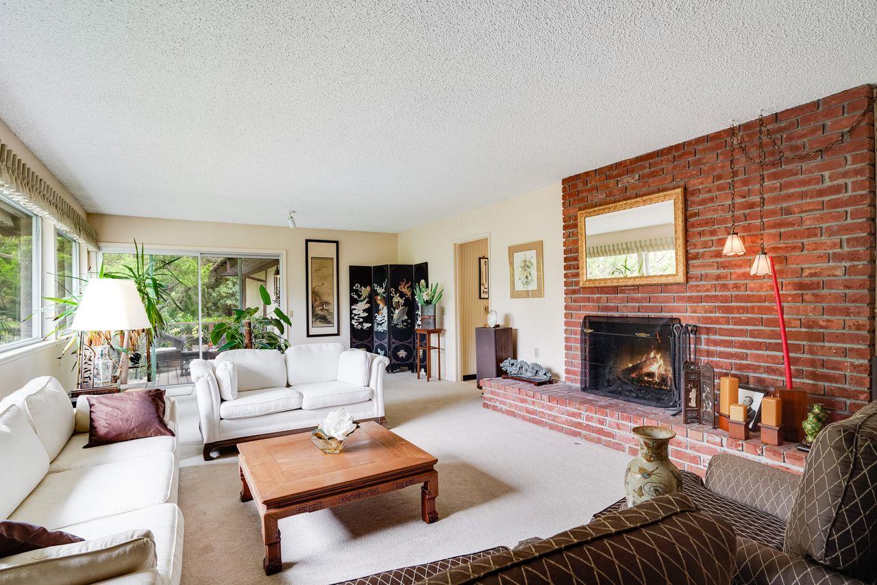 3 Forest Knoll Road Monterey, CA 93940 - Photo 33 of 63 a living room with furniture fireplace and a large window
