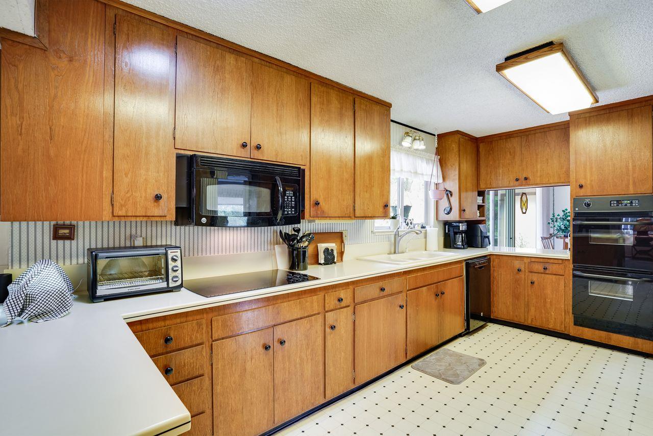 3 Forest Knoll Road Monterey, CA 93940 - Photo 36 of 63 a kitchen with stainless steel appliances granite countertop a sink a stove and cabinets