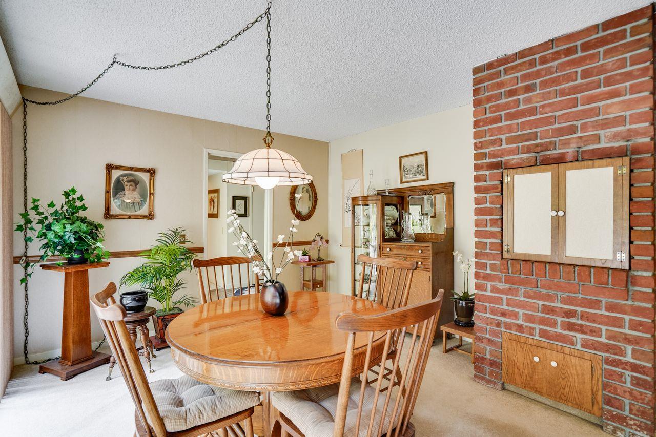 3 Forest Knoll Road Monterey, CA 93940 - Photo 43 of 63 a dining room with furniture potted plants and wooden floor