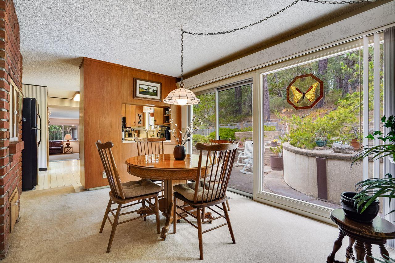 3 Forest Knoll Road Monterey, CA 93940 - Photo 45 of 63 a dining room with furniture a window and a chandelier